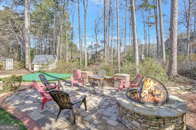 view of patio / terrace featuring an outdoor fire pit