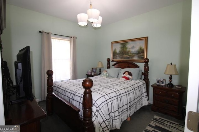 bedroom with a notable chandelier