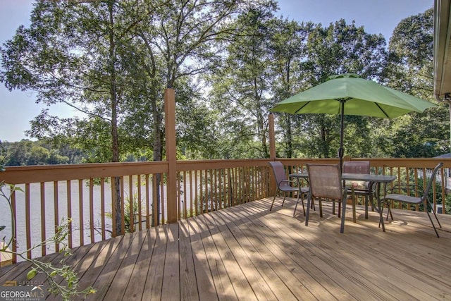 wooden terrace with a water view