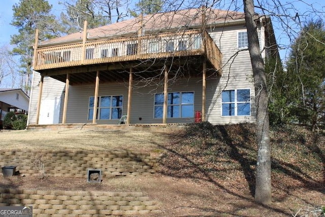 rear view of property with a deck