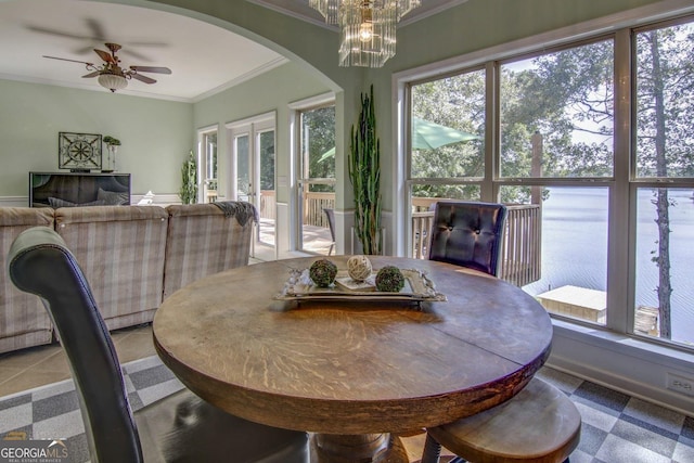 dining area with ornamental molding and ceiling fan with notable chandelier