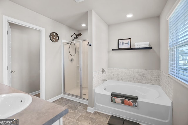 bathroom with vanity and plus walk in shower