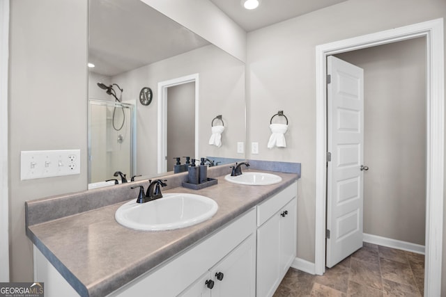 bathroom featuring vanity and a shower with door