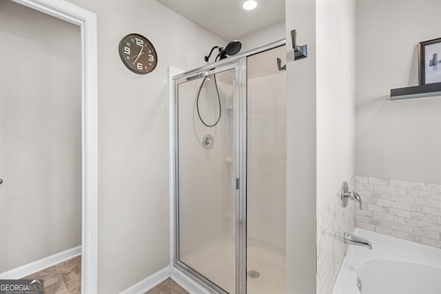 bathroom with independent shower and bath