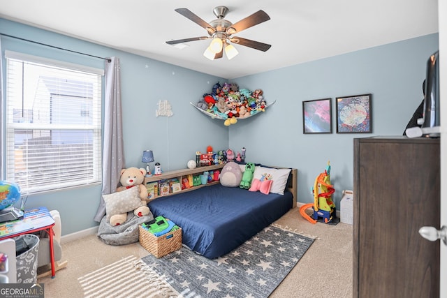 carpeted bedroom with ceiling fan