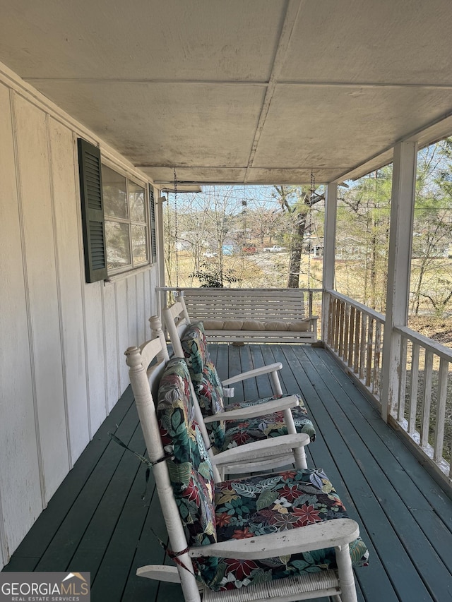 wooden terrace featuring a porch