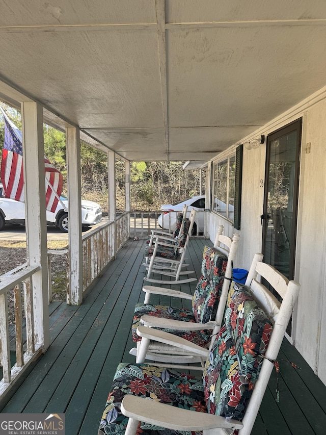 wooden deck featuring a porch