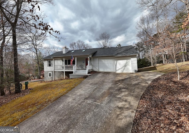 view of front of home featuring a garage and covered porch