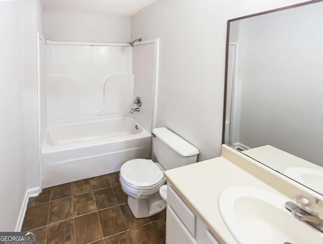 full bathroom with vanity, tile patterned floors, toilet, and washtub / shower combination