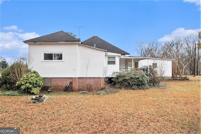 view of home's exterior featuring a yard