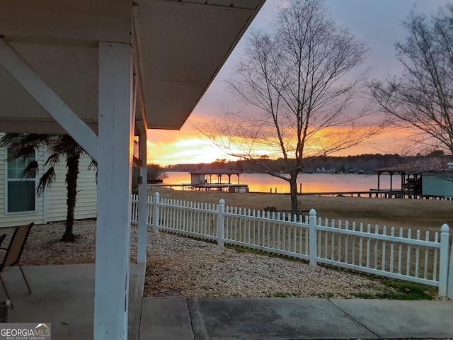 yard at dusk with a water view