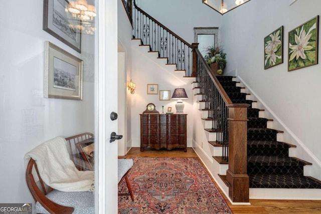 staircase featuring wood-type flooring