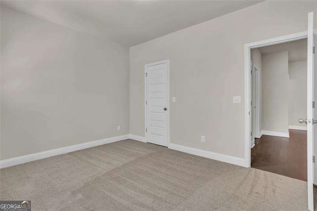 unfurnished bedroom with carpet floors