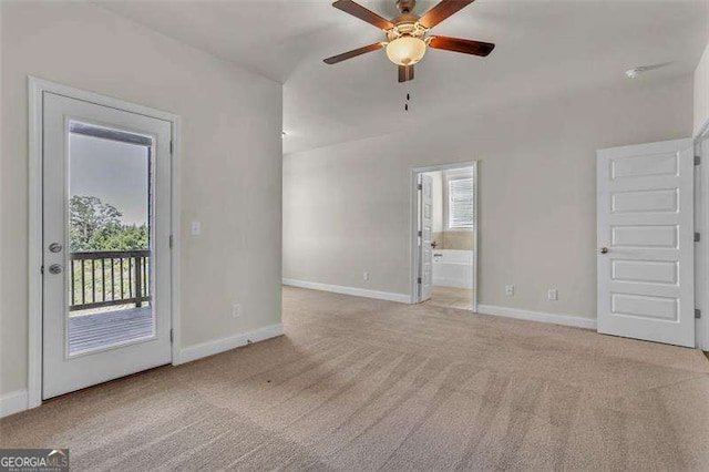 unfurnished living room featuring ceiling fan, light carpet, and a wealth of natural light