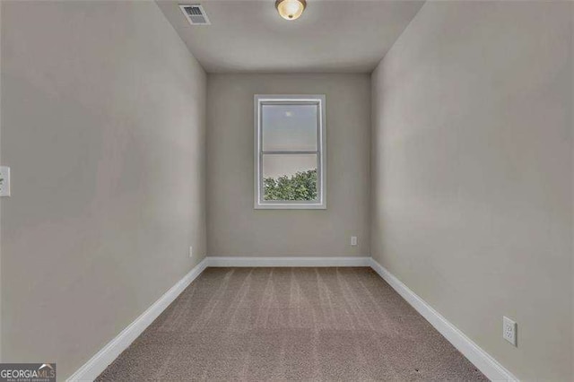 unfurnished room with carpet flooring