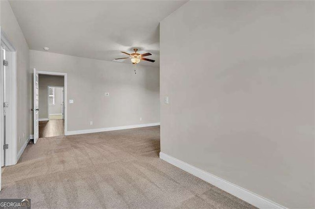 unfurnished room featuring carpet flooring and ceiling fan