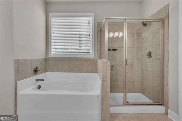 bathroom featuring tile patterned floors and plus walk in shower