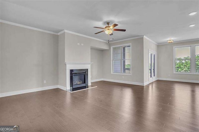 unfurnished living room featuring dark wood-type flooring, ceiling fan, and ornamental molding