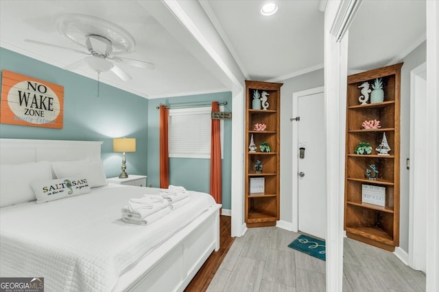 bedroom featuring crown molding and ceiling fan