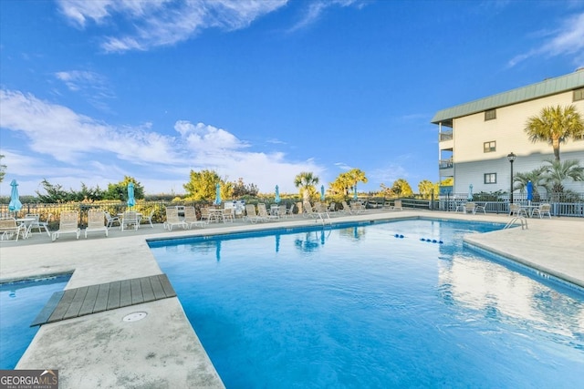 view of swimming pool with a patio area