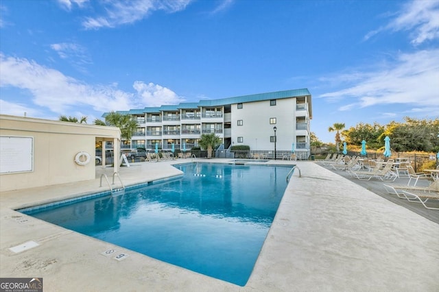 view of swimming pool with a patio area