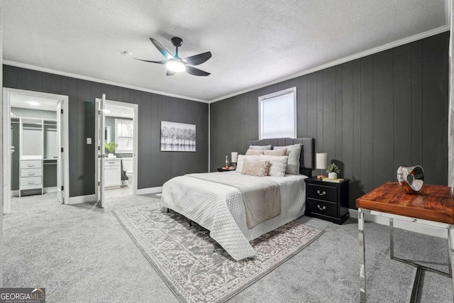 bedroom featuring multiple windows, ceiling fan, light carpet, and a textured ceiling