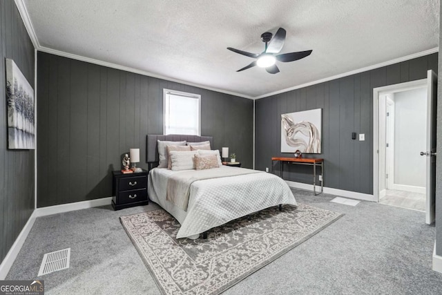 bedroom featuring ceiling fan, light colored carpet, and a textured ceiling