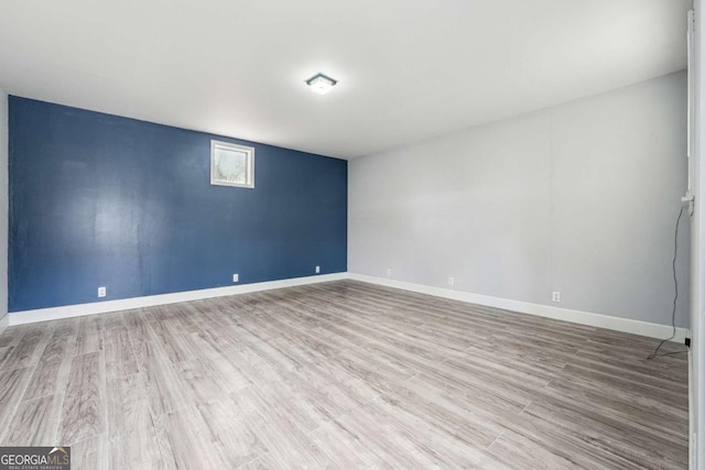 unfurnished room featuring hardwood / wood-style floors