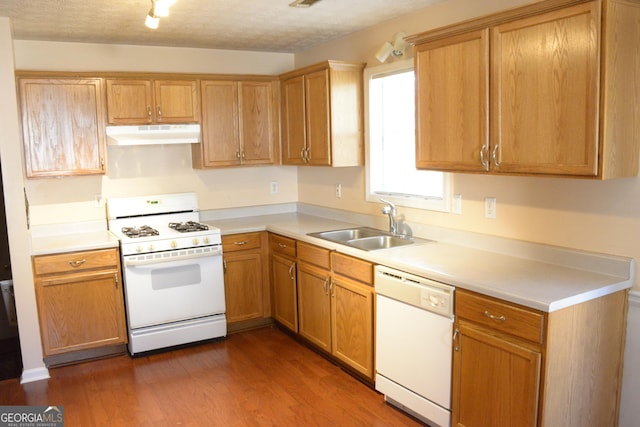 3013 Pommel Ct, Conyers, GA 30013 - kitchen featuring white appliances, under cabinet range hood, dark wood-style floors, and light countertops