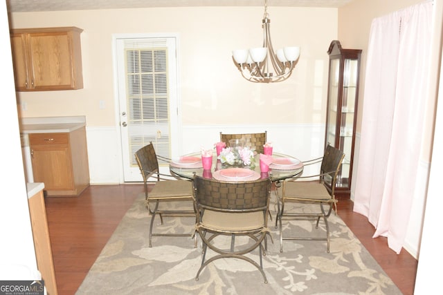 3013 Pommel Ct, Conyers, GA 30013 - dining room featuring a chandelier and dark wood-type flooring