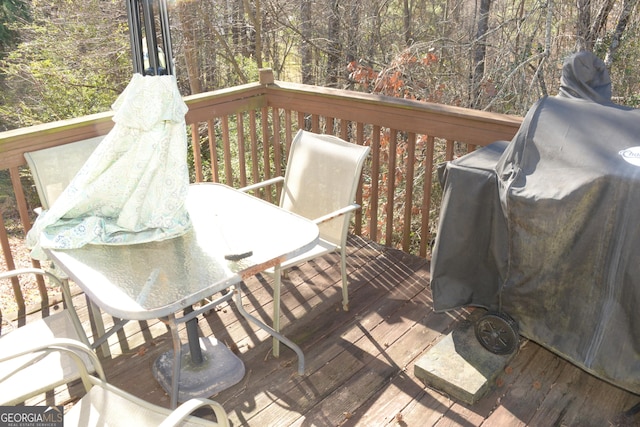 wooden deck featuring grilling area