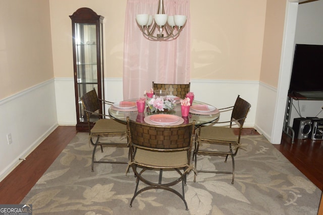 3013 Pommel Ct, Conyers, GA 30013 - dining space with a chandelier and wood finished floors
