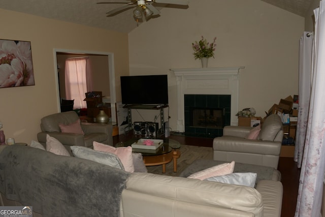 3013 Pommel Ct, Conyers, GA 30013 - living area featuring vaulted ceiling, a ceiling fan, and a tile fireplace