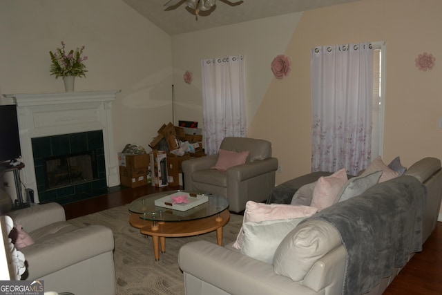 3013 Pommel Ct, Conyers, GA 30013 - living room featuring ceiling fan, wood finished floors, vaulted ceiling, and a tiled fireplace