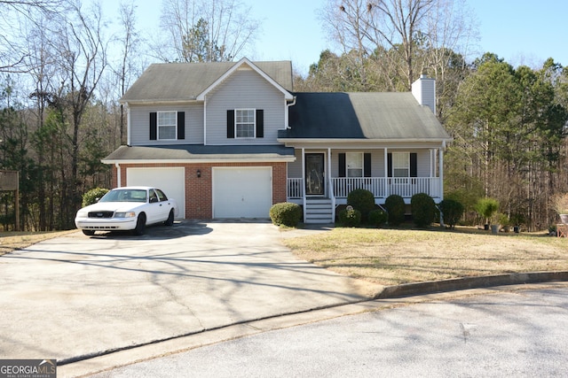 front of property featuring a garage and a porch