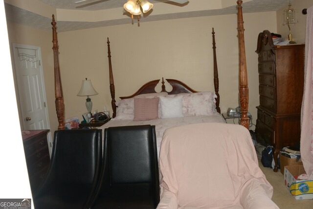 carpeted bedroom featuring a textured ceiling