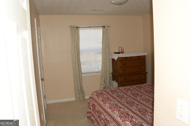 3013 Pommel Ct, Conyers, GA 30013 - carpeted bedroom with a textured ceiling and baseboards