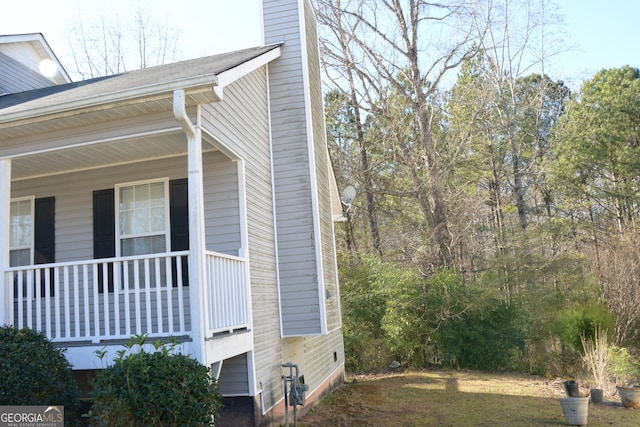 3013 Pommel Ct, Conyers, GA 30013 - view of side of home with a chimney and a porch
