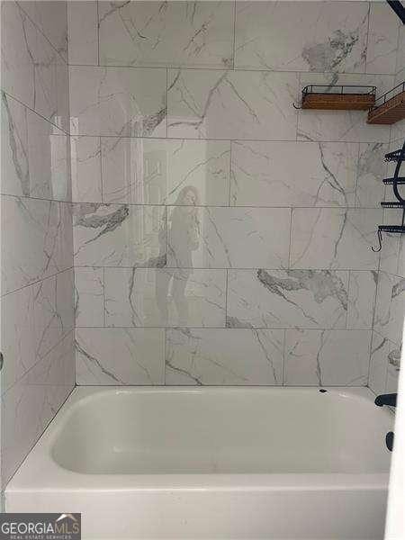 bathroom featuring bathing tub / shower combination