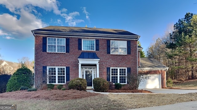 colonial home with a garage