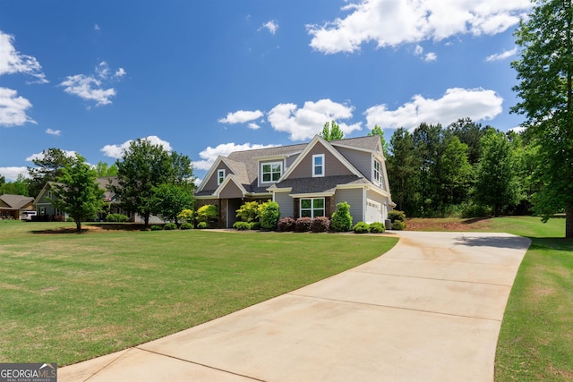 craftsman house with a garage and a front lawn