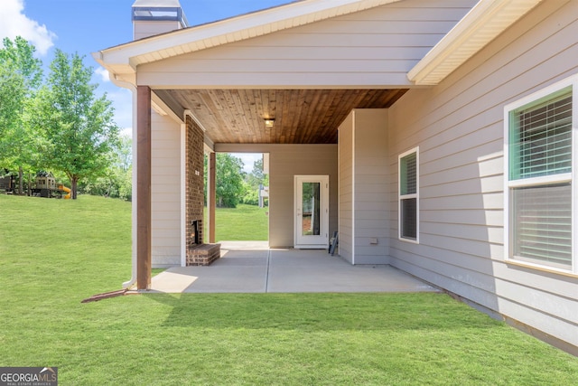 view of patio with an outdoor brick fireplace