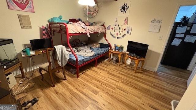 bedroom with hardwood / wood-style flooring