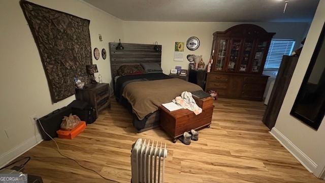 bedroom with light wood-type flooring