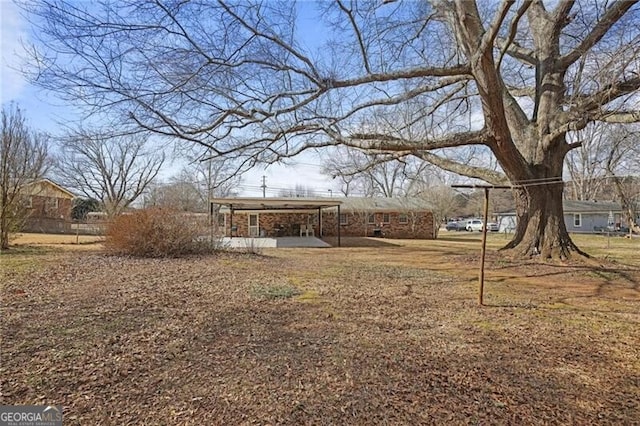 view of yard featuring a carport