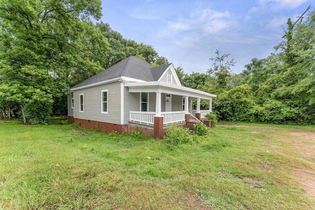 view of front of house featuring a front yard and a porch