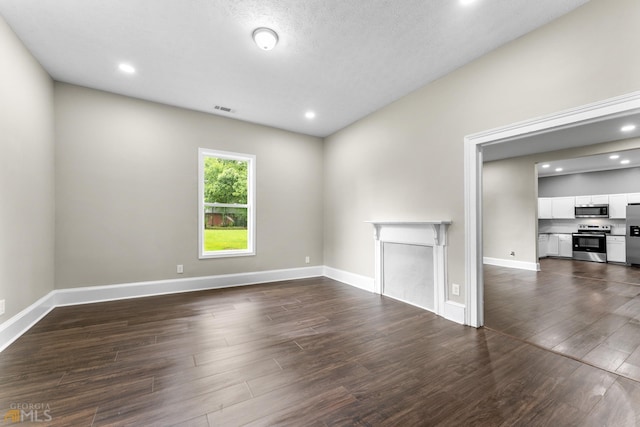 unfurnished room with dark hardwood / wood-style floors