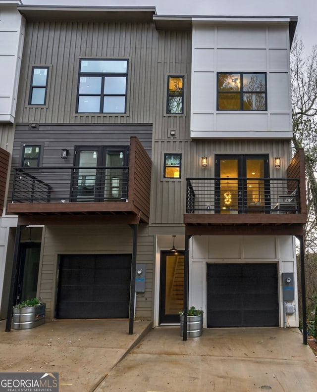 view of front facade featuring a balcony and a garage