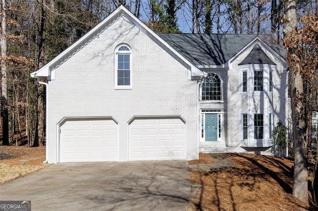 front facade with a garage