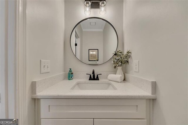 bathroom featuring vanity and crown molding